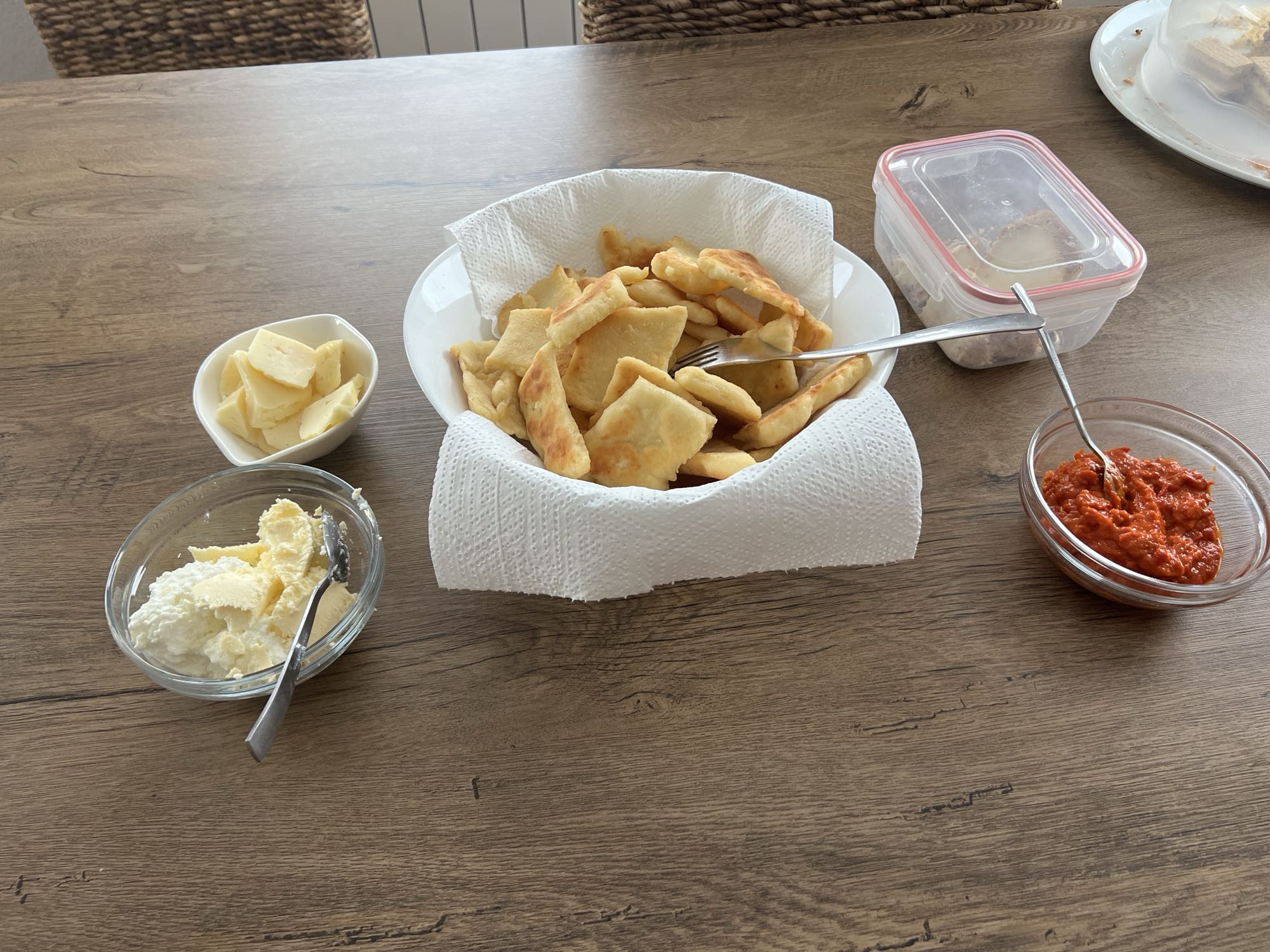 Uštipci with ajvar, cottage cheese, kajmak, and white cheese