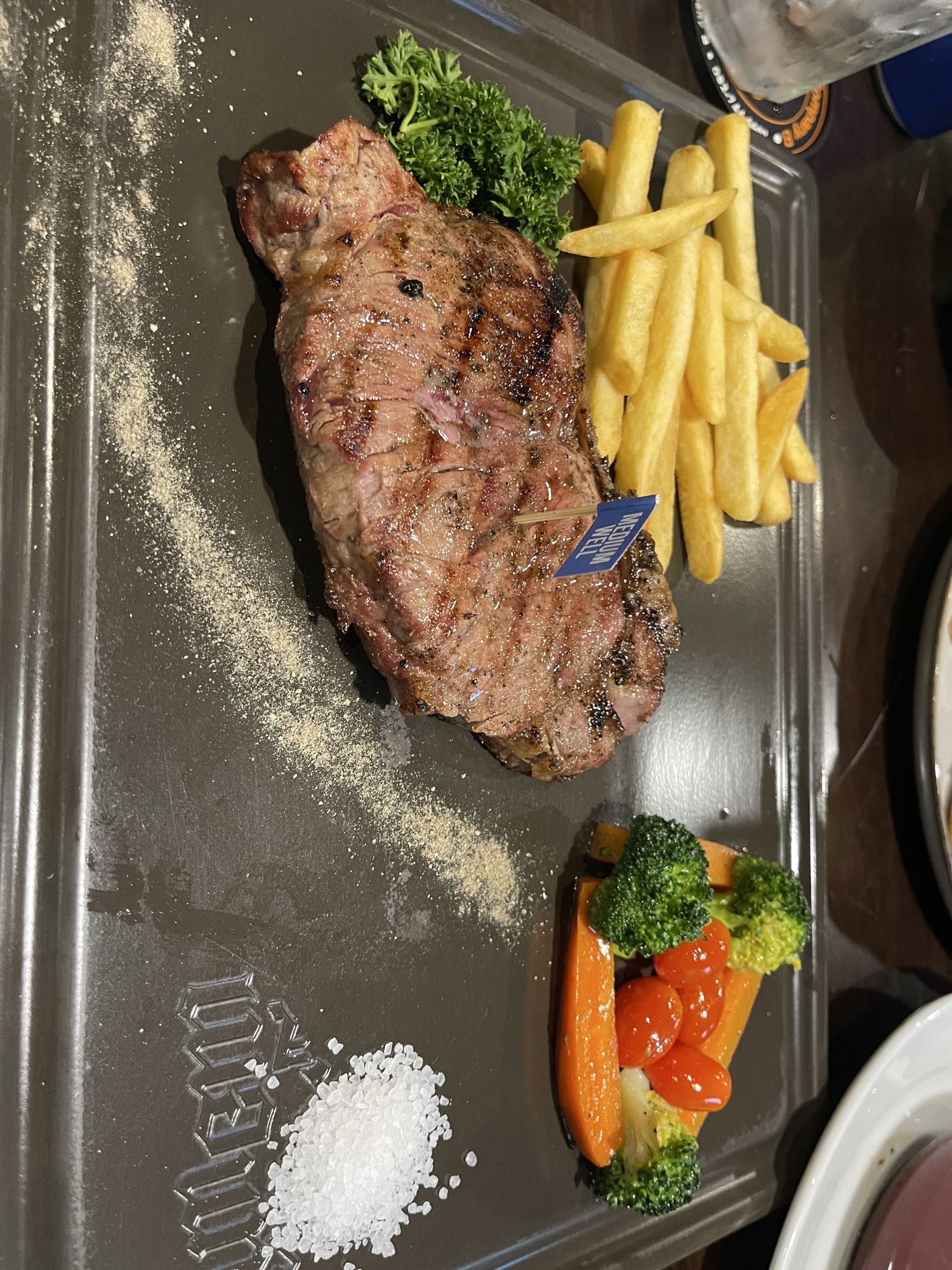 Steak with fries and veggies