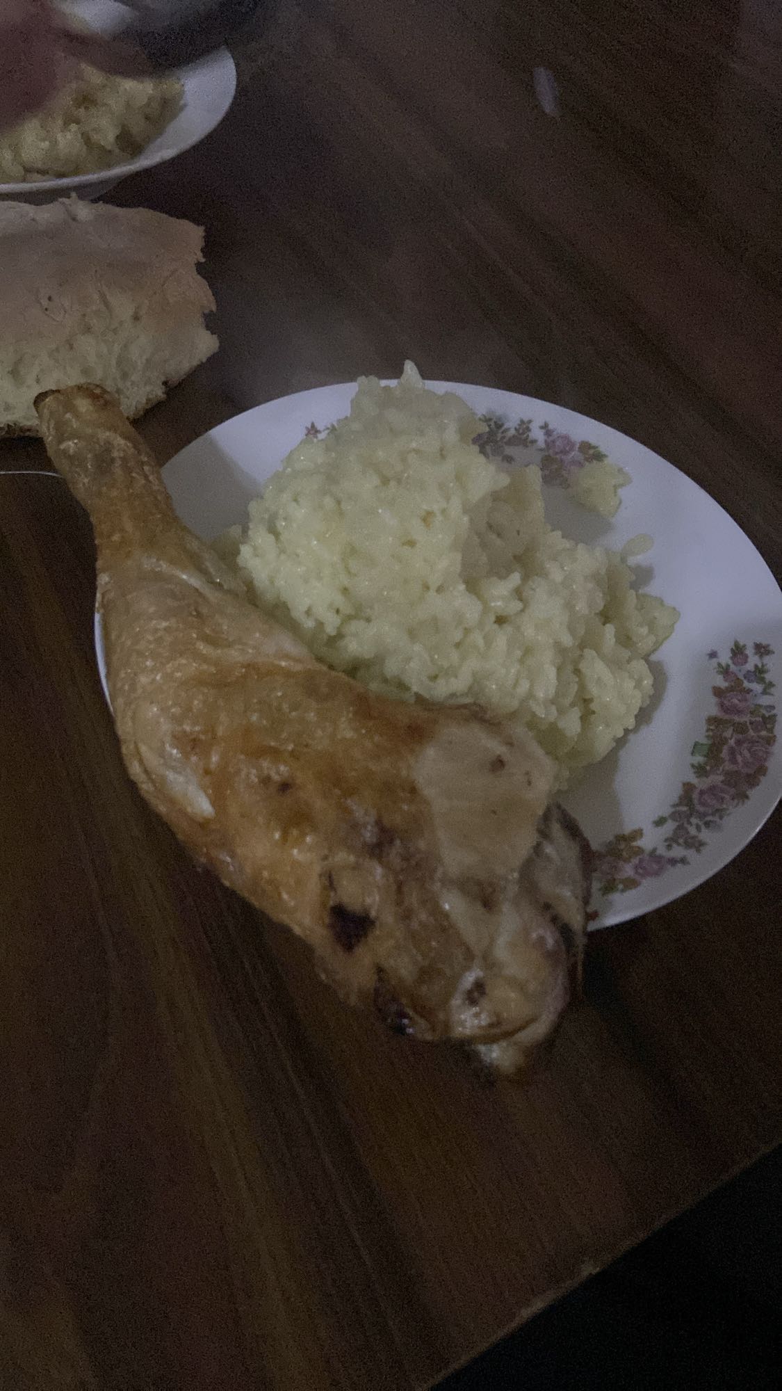 Chicken leg with rice and bread