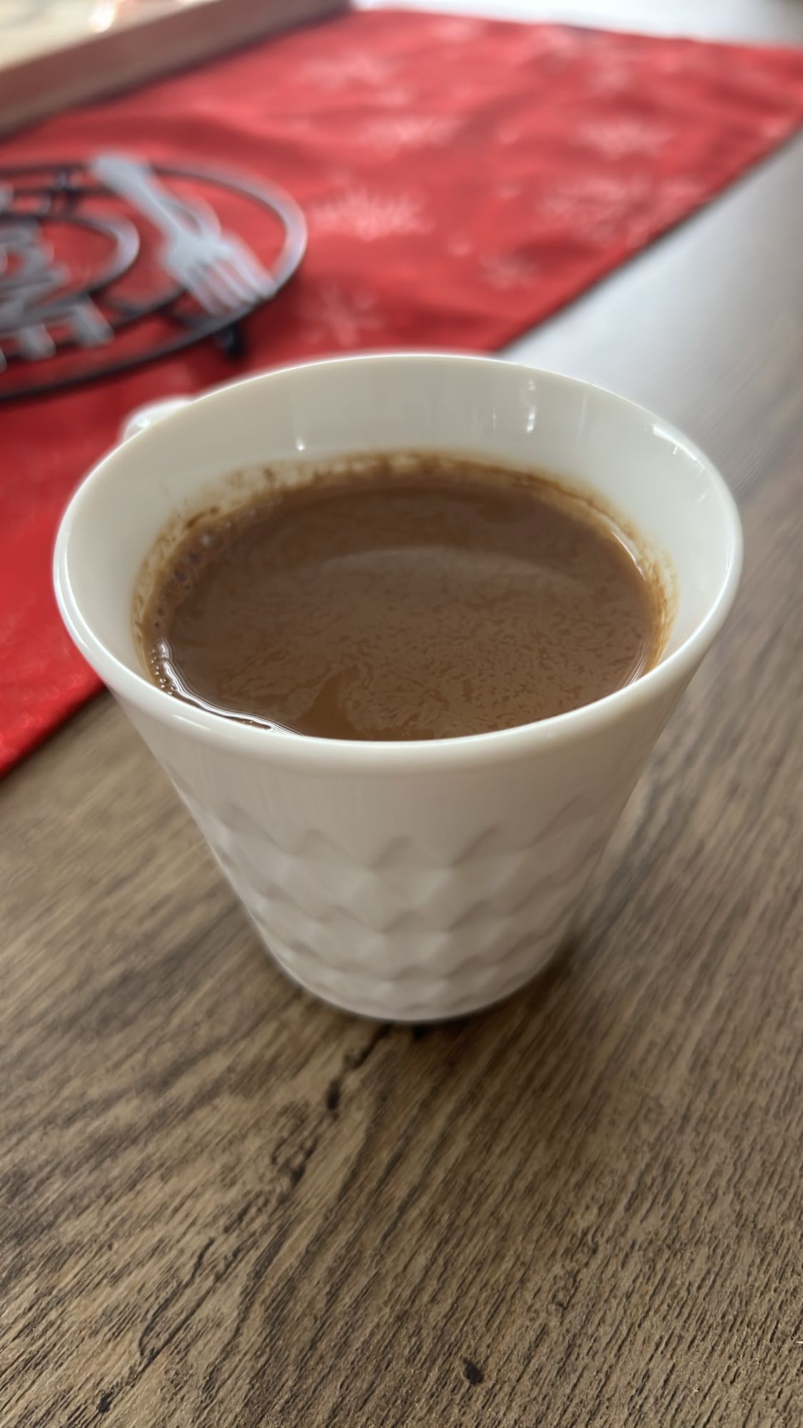 Turkish coffee with small spoon of milk