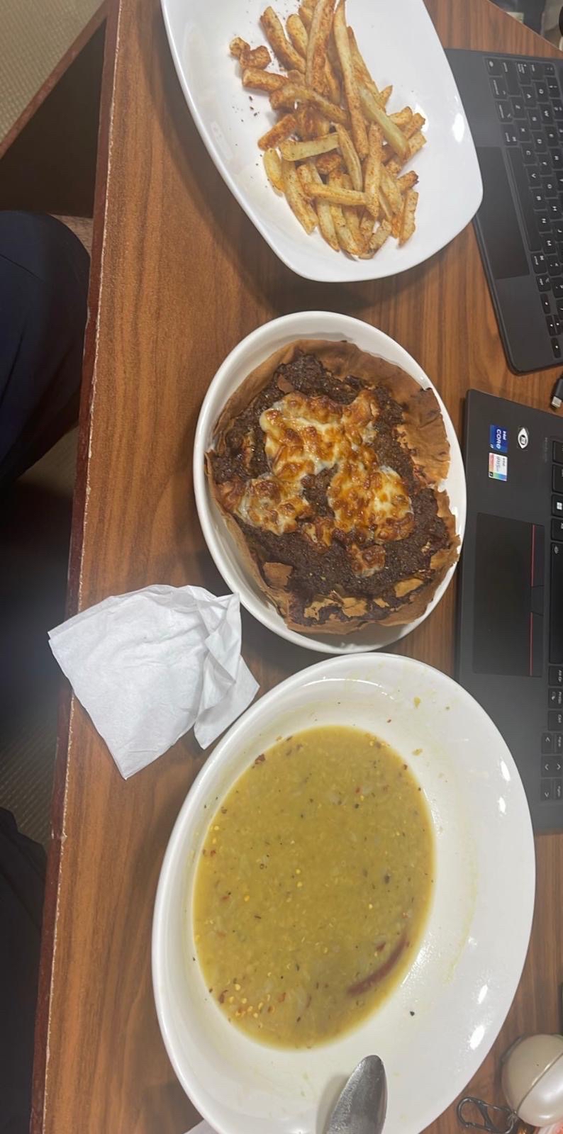 Soup, fries, meat pie, yogurt and flatbread