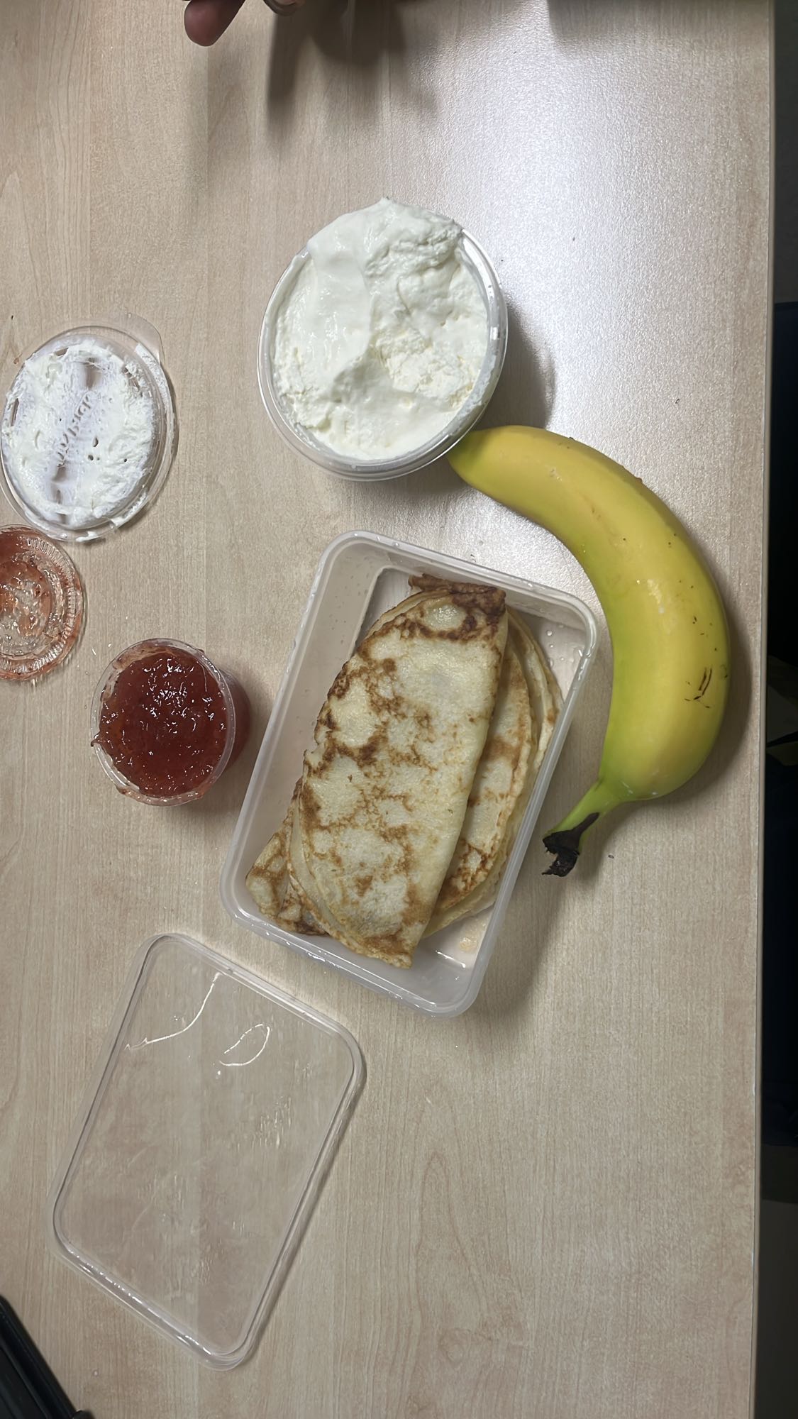 Crepes with yogurt, jam, banana