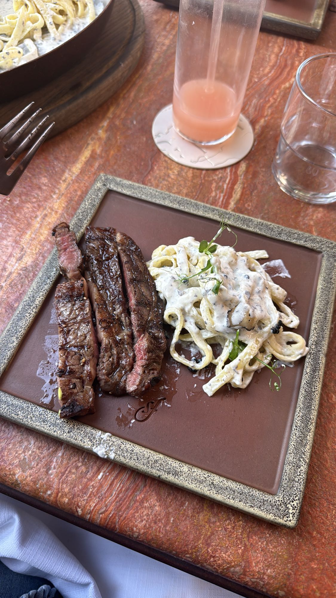 Steak with creamy pasta