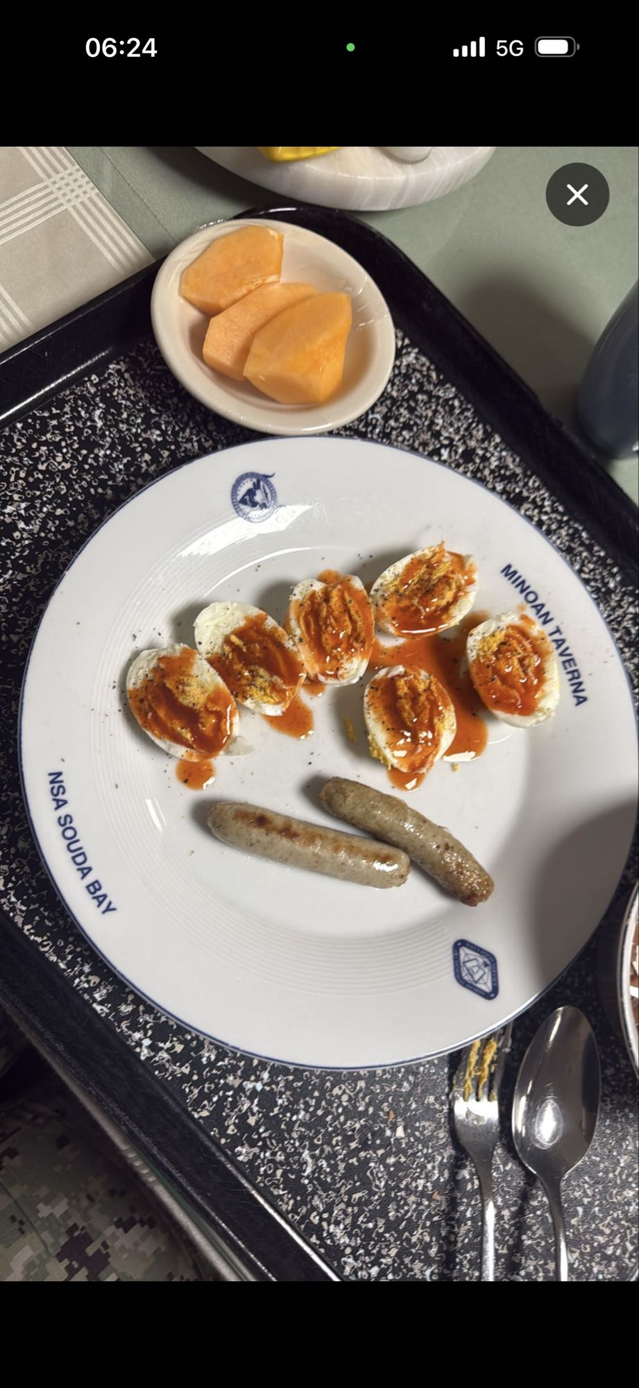 Eggs, sausage, melon breakfast