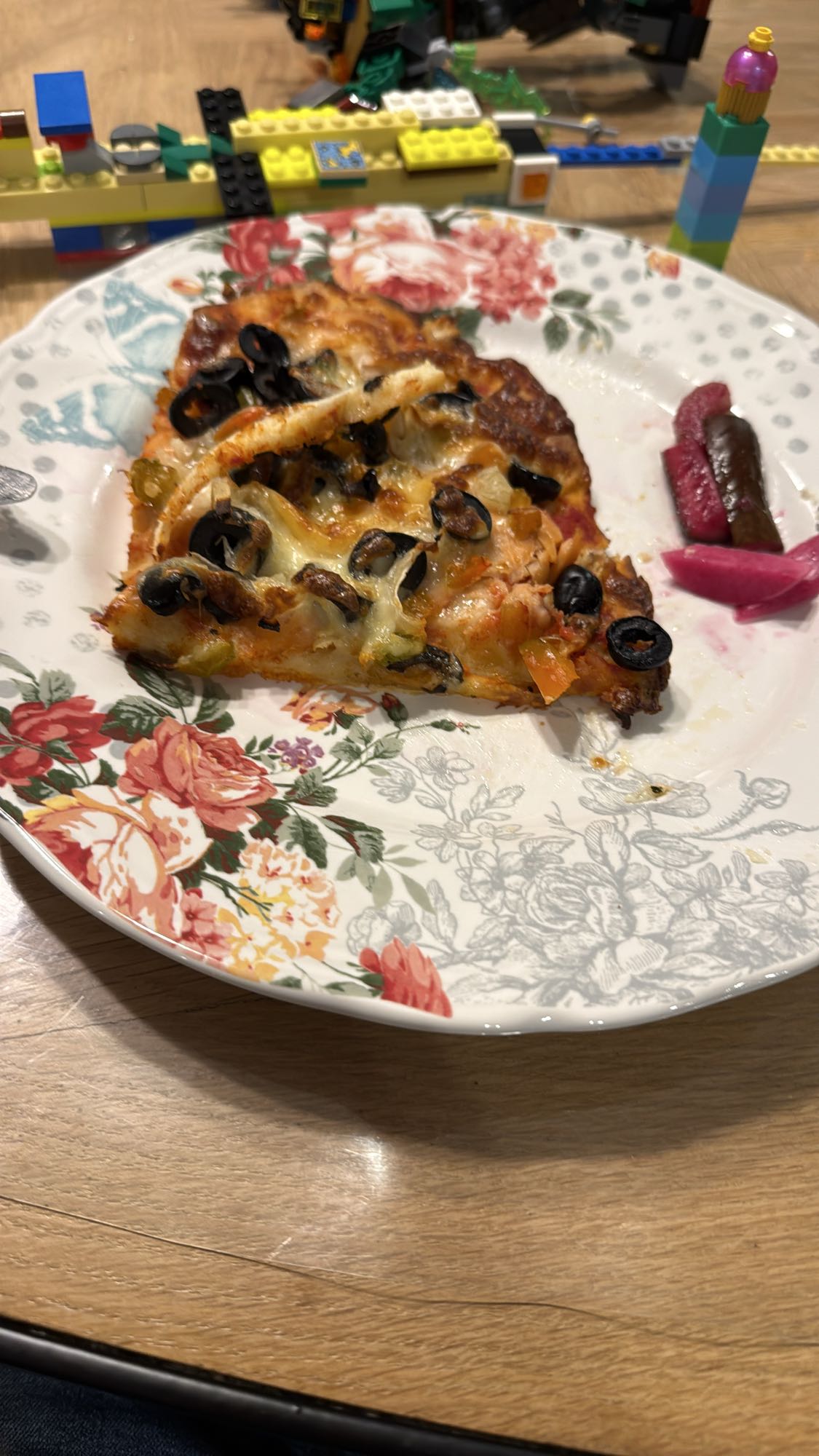 Vegetable pizza slice with salmon & pickles