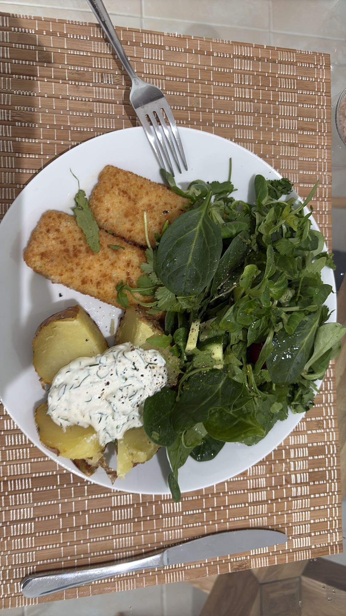 Fish, potato, and salad plate