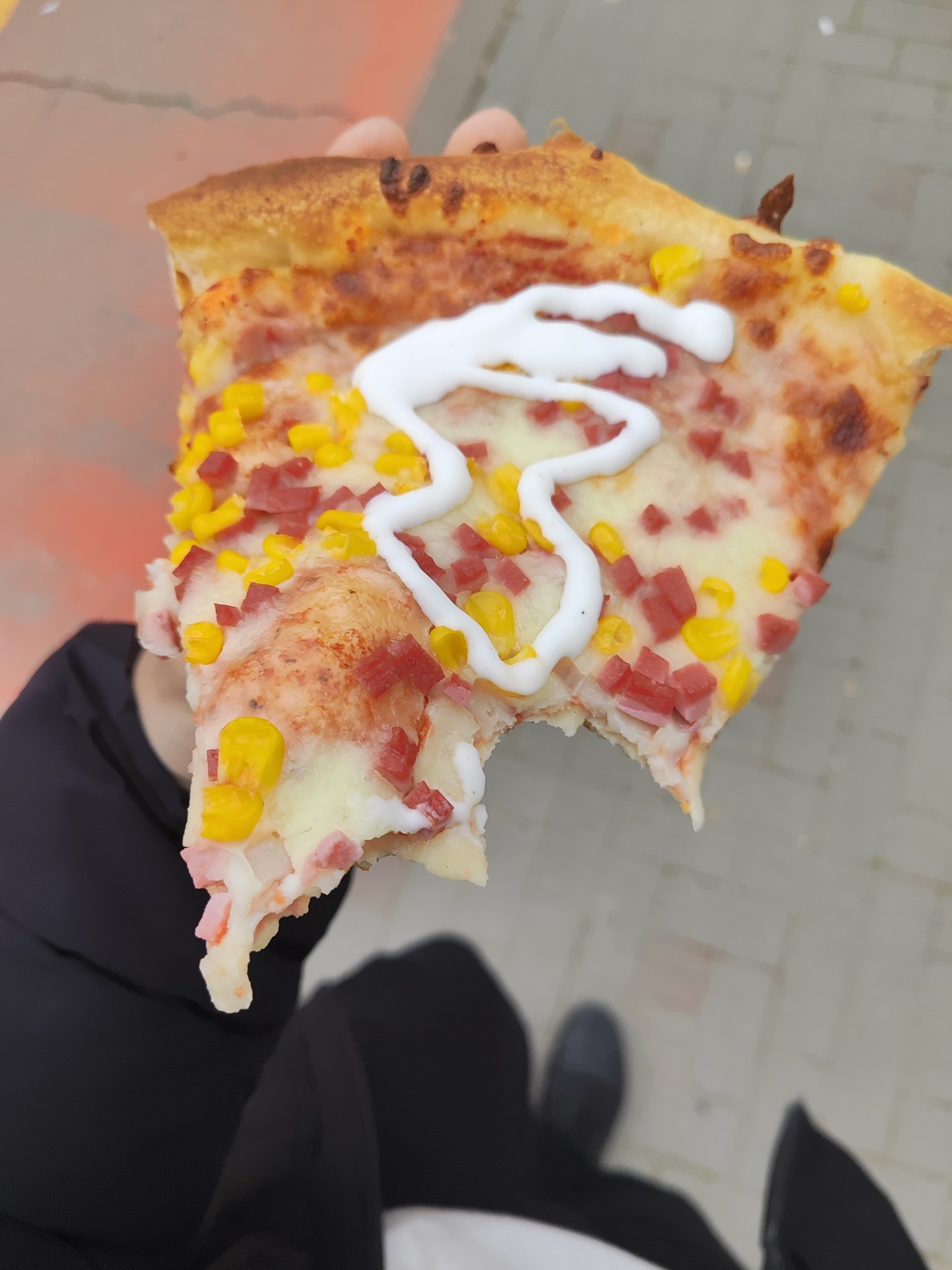 Pizza slice with corn