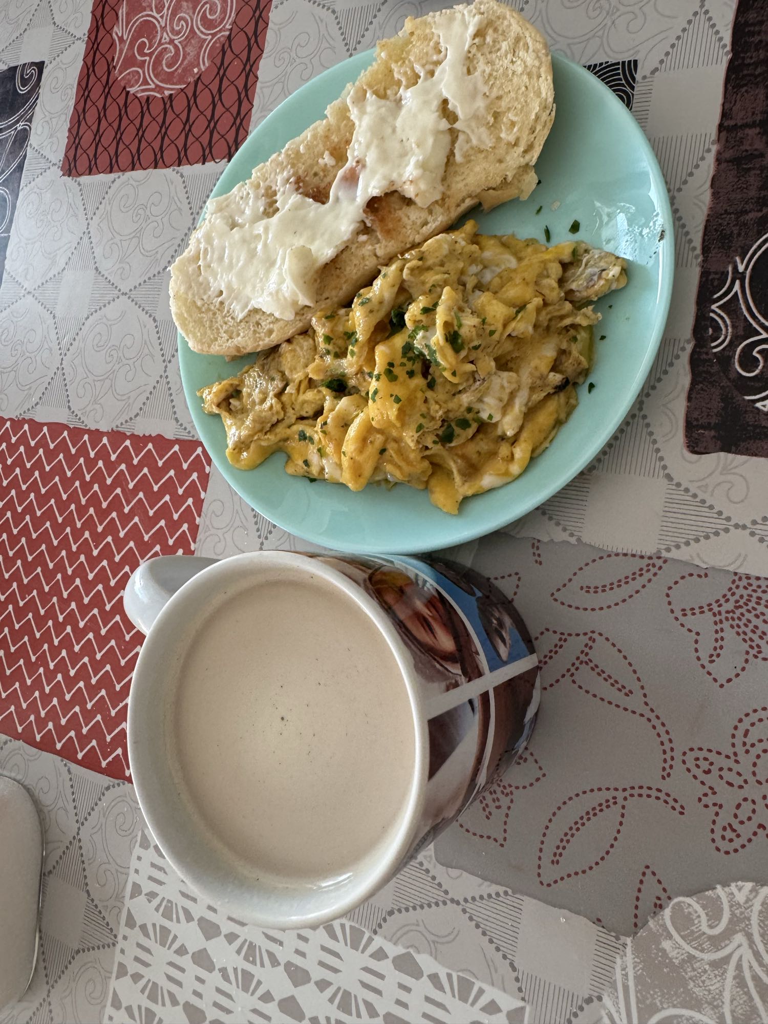 Scrambled eggs, bread, coffee