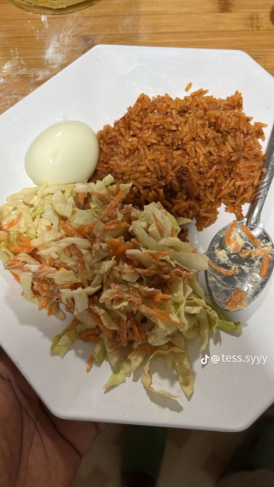 Jollof rice, salad, egg