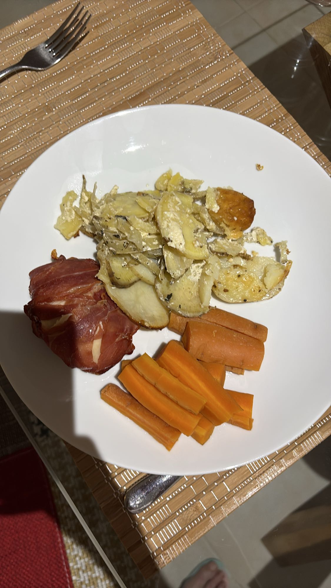 Chicken Breast Wrapped in Serrano Ham with Steamed Carrots and Sweet Potato, Potato and Fennel Bake
