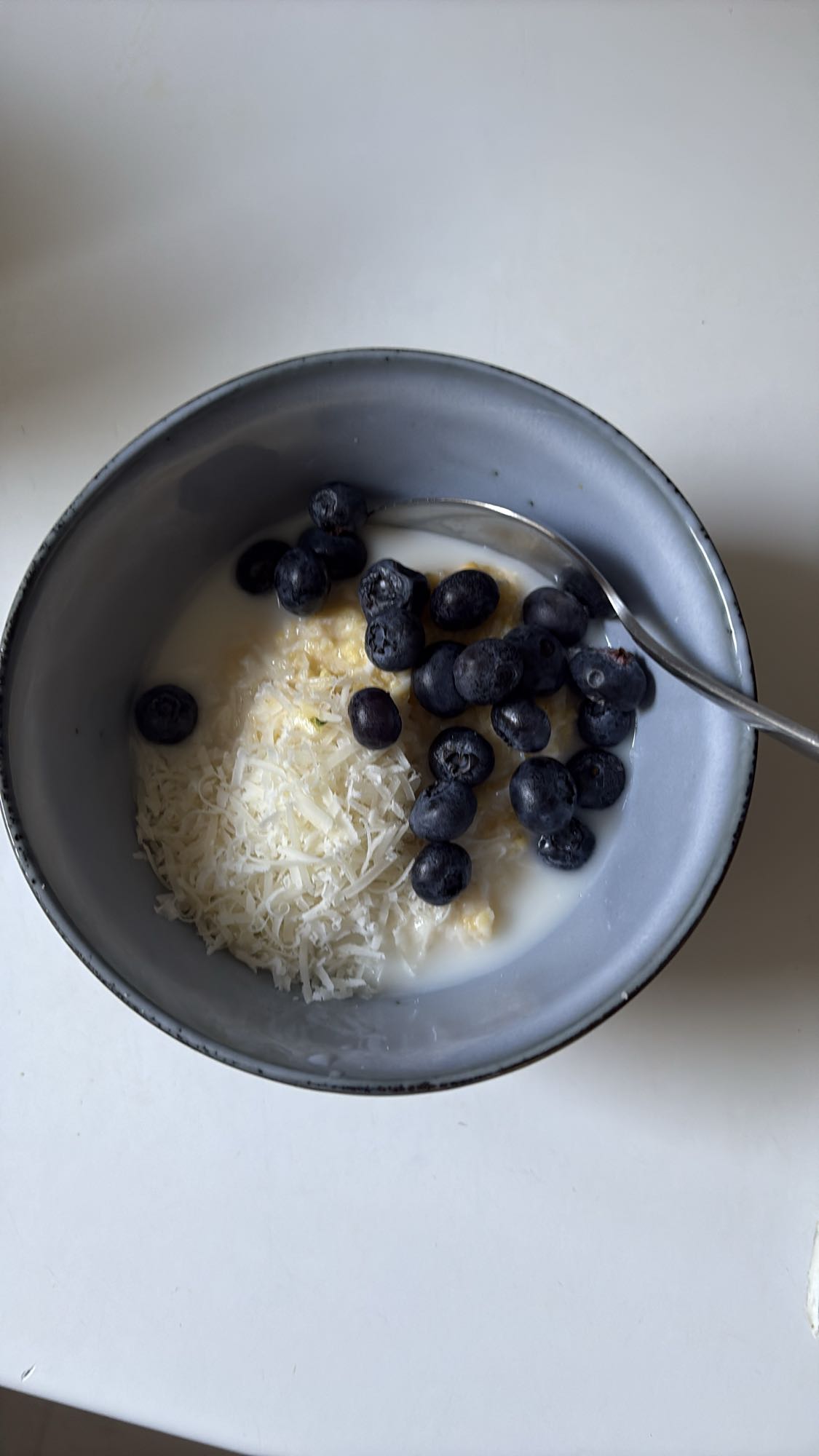 Blueberry Almond Milk Millet Bowl with Two Eggs